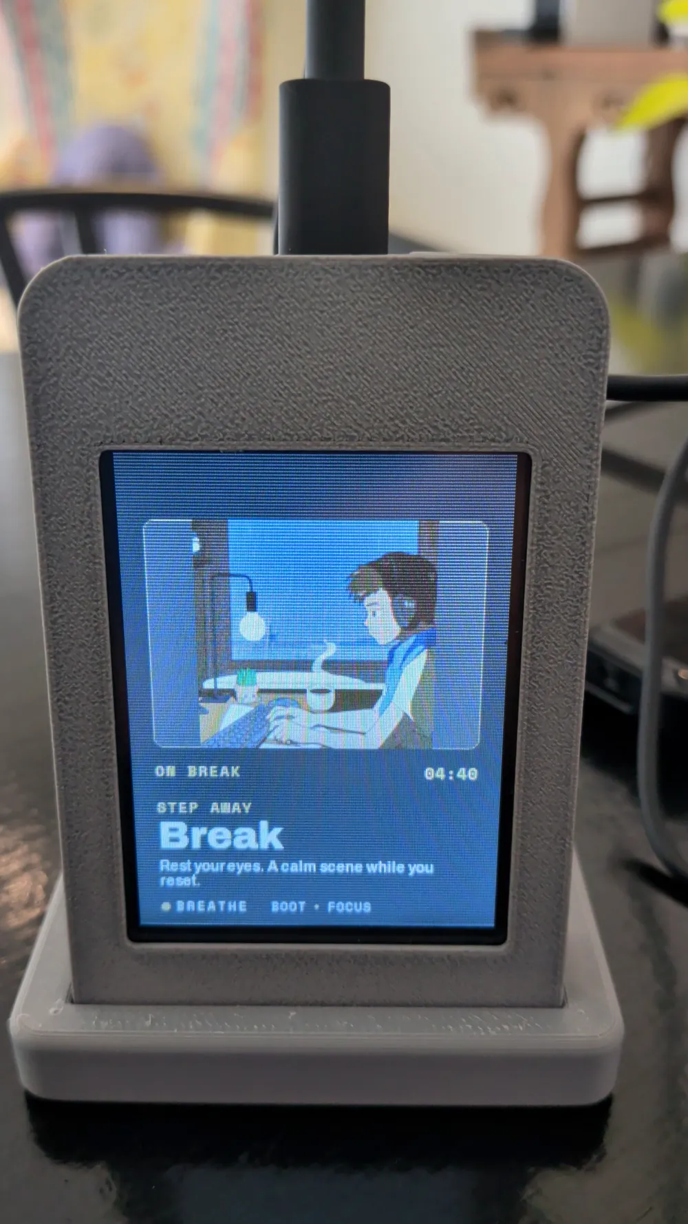 Physical Pomodoist device in a printed enclosure, showing its break timer